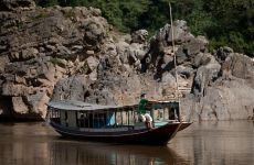laos boat-mekong-river-laos-man